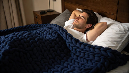 man sleeping with handknitted weighted blanket